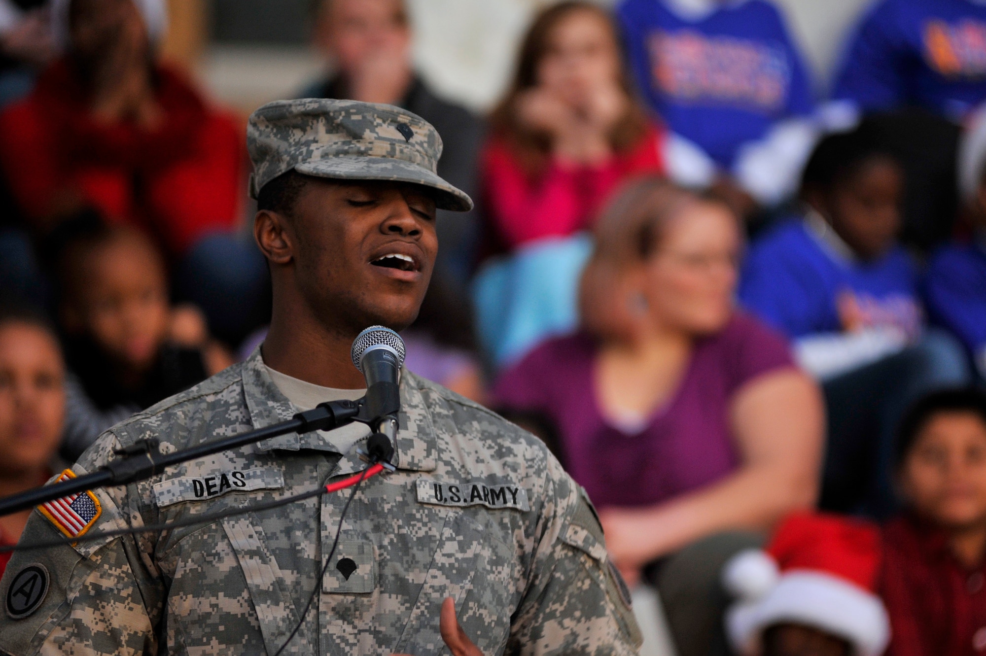 U.S. Army Spc. Tavon Deas, Third Army/U.S Army Central signal support systems specialist, performs during Sumter's Christmas Tree Lighting Ceremony, Dec. 2, 2011, Sumter, S.C. The annual ceremony brought out the holiday spirit as several elementary school choirs performed Christmas carols for those who gathered at the courthouse to witness the celebration. (U.S. Air Force photo by Senior Airman Kenny Holston/Released)


