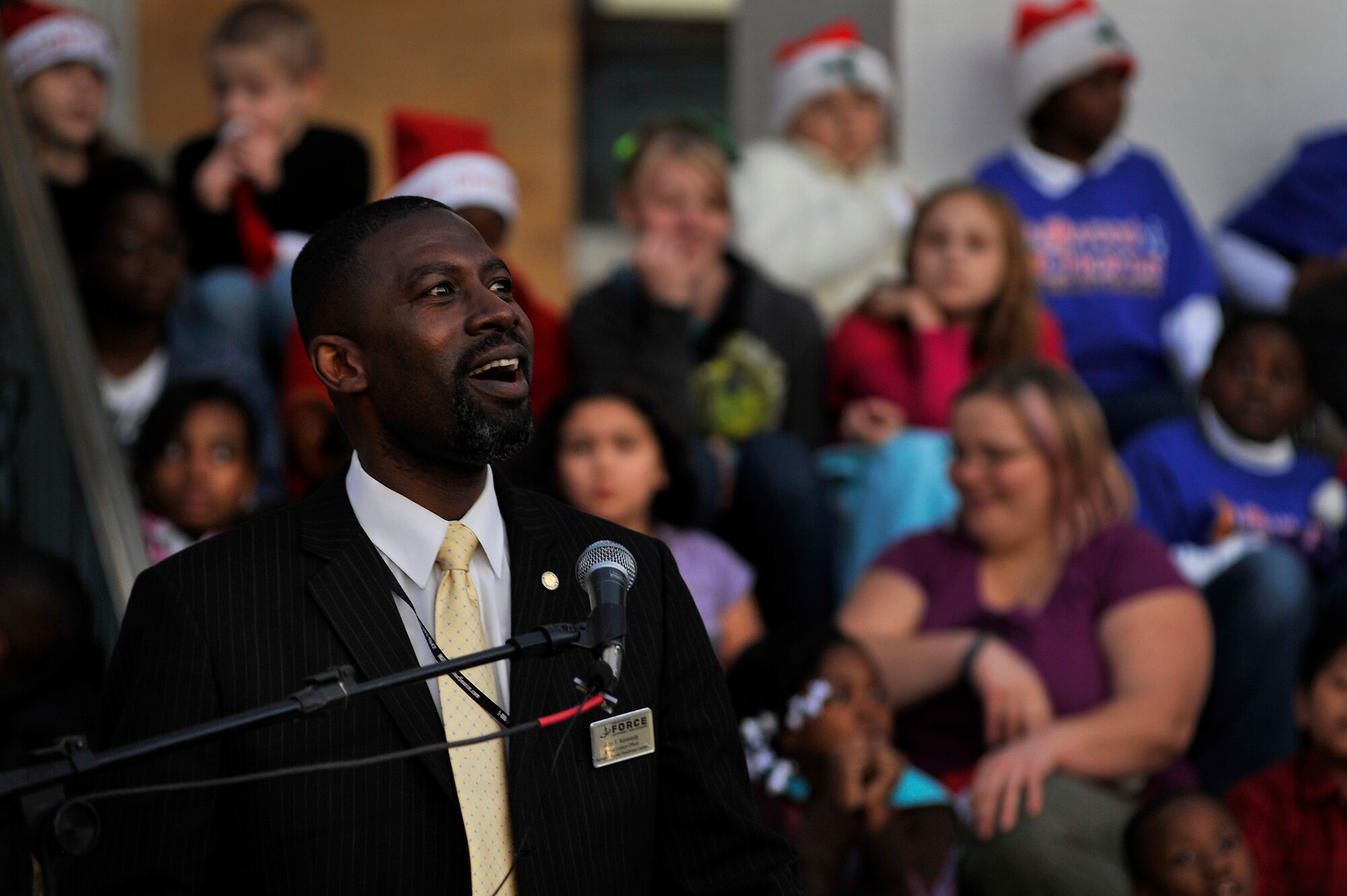 John Kennedy, 20th Force Support Squadron school liaison officer, performs during Sumter's Christmas Tree Lighting Ceremony, Dec. 2, 2011, Sumter, S.C. The annual ceremony brought out the holiday spirit as several elementary school choirs performed Christmas carols for those who gathered at the courthouse to witness the celebration. (U.S. Air Force photo by Senior Airman Kenny Holston/Released)


