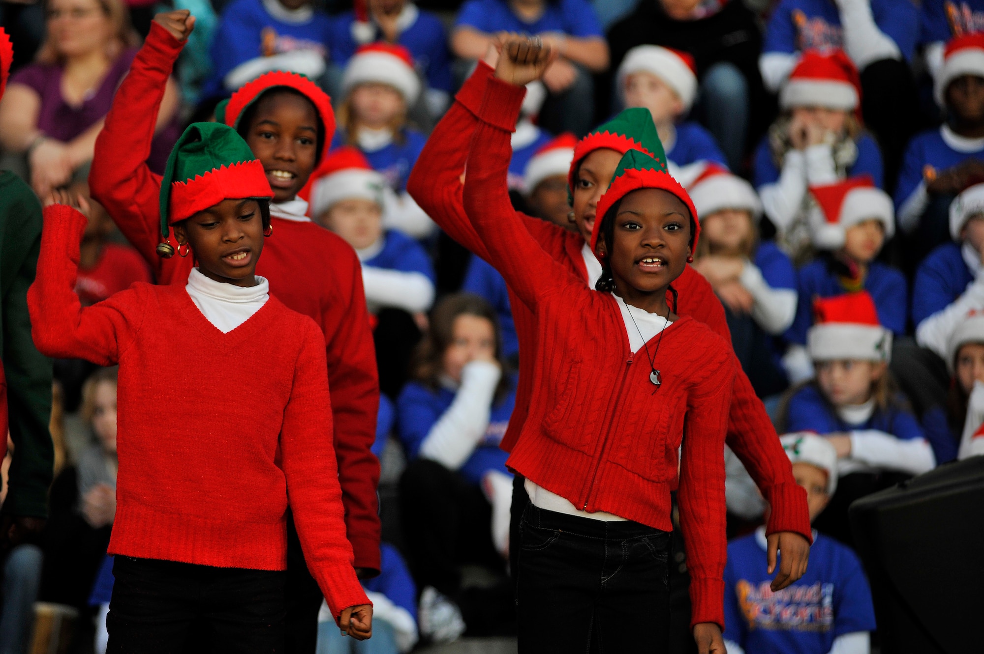 Children from the Lemira Elementary School, perform in front of the Sumter County Courthouse as part of Sumter's Christmas Tree Lighting Ceremony, Dec. 2, 2011, Sumter, S.C. The annual ceremony brought out the holiday spirit as several elementary school choirs performed Christmas carols for those who gathered at the courthouse to witness the celebration. (U.S. Air Force photo by Senior Airman Kenny Holston/Released)


