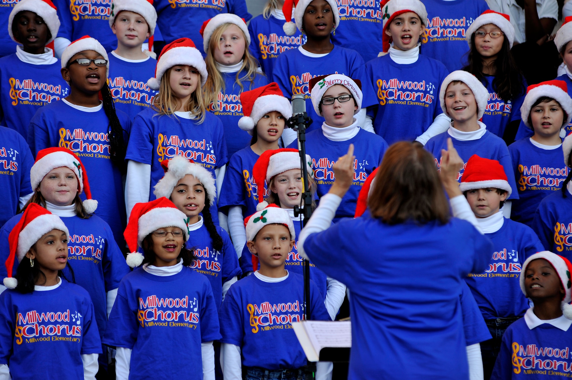 The Millwood Elementary School Choir performs on the steps of the Sumter County Courthouse as part of Sumter's Christmas Tree Lighting Ceremony, Dec. 2, 2011, Sumter, S.C. The annual ceremony brought out the holiday spirit as several elementary school choirs performed Christmas carols for those who gathered at the courthouse to witness the celebration. (U.S. Air Force photo by Senior Airman Kenny Holston/Released)


