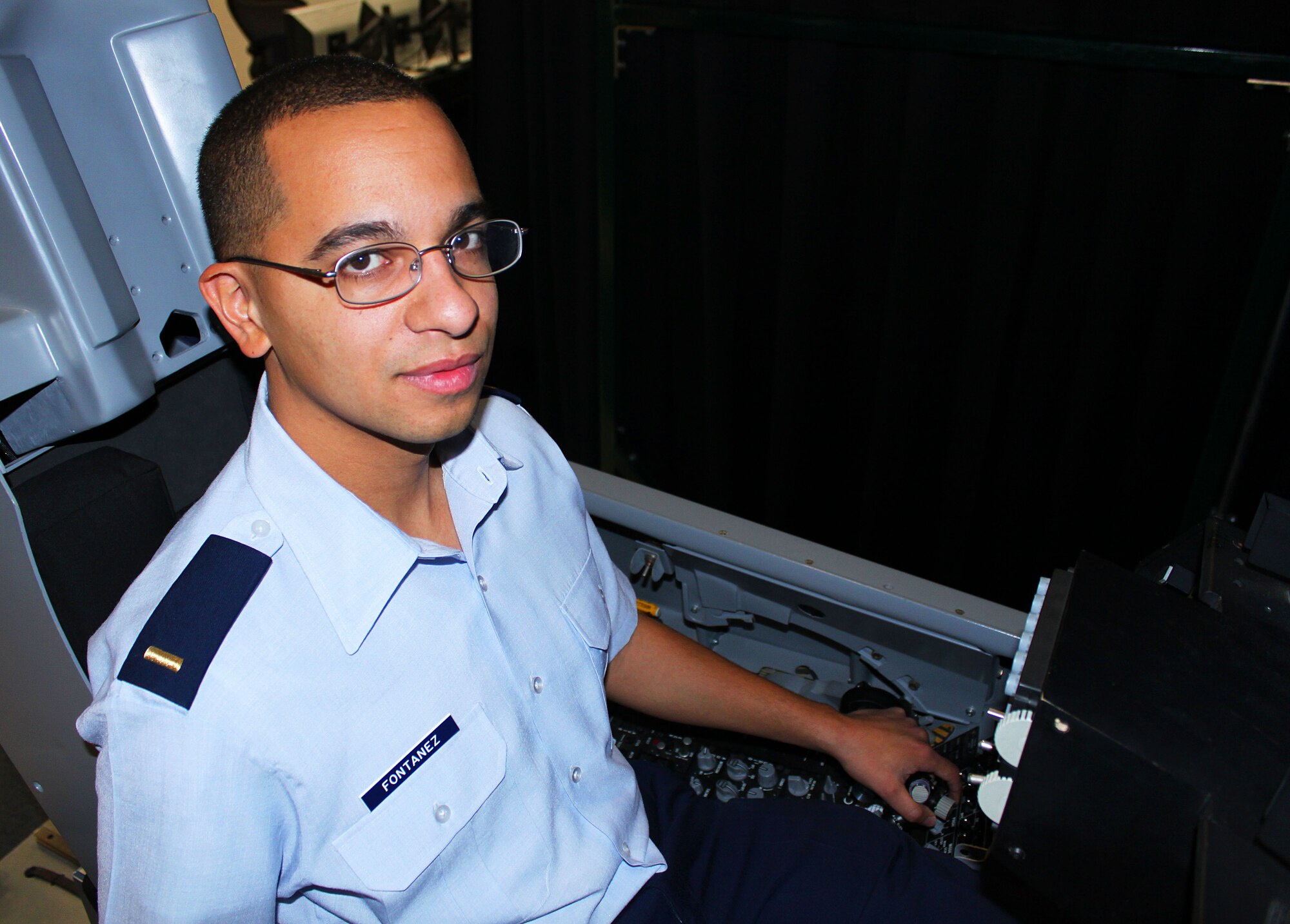 Modernizing the U.S. Air Force is the mission of this week's warrior. 2nd Lt. Sergio Fontanez supports the warfighter by bringing new technologies, like those used in this F-16 simulator to test at 412th Electronic Warfare Group here. (U.S. Air Force Photo by Meredith Mingledorff) 