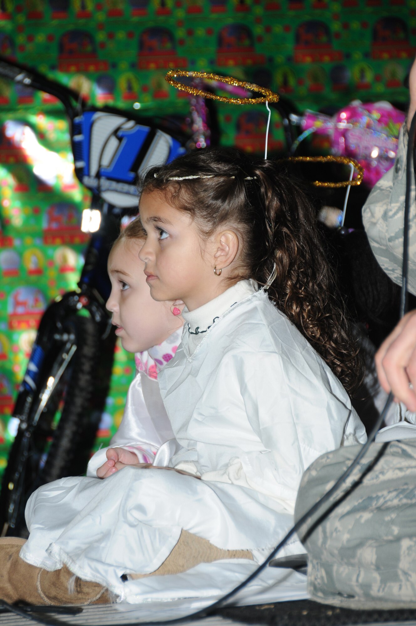 Five-year-old Mia Flores, dependant of Staff Sgt. Cornelio and Shawna Flores, 336th Training Squadron, dressed as an angel, participates in the Nativity Scene during Keesler’s annual Holiday in the Park at the Marina Park, Keesler Air Force Base, Miss. Dec. 1, 2011.  The event included a tree lighting ceremony, hay rides, holiday music by the Keesler Choir, visit with Santa and free food and beverages.  (U.S. Air Force photo by Kemberly Groue)