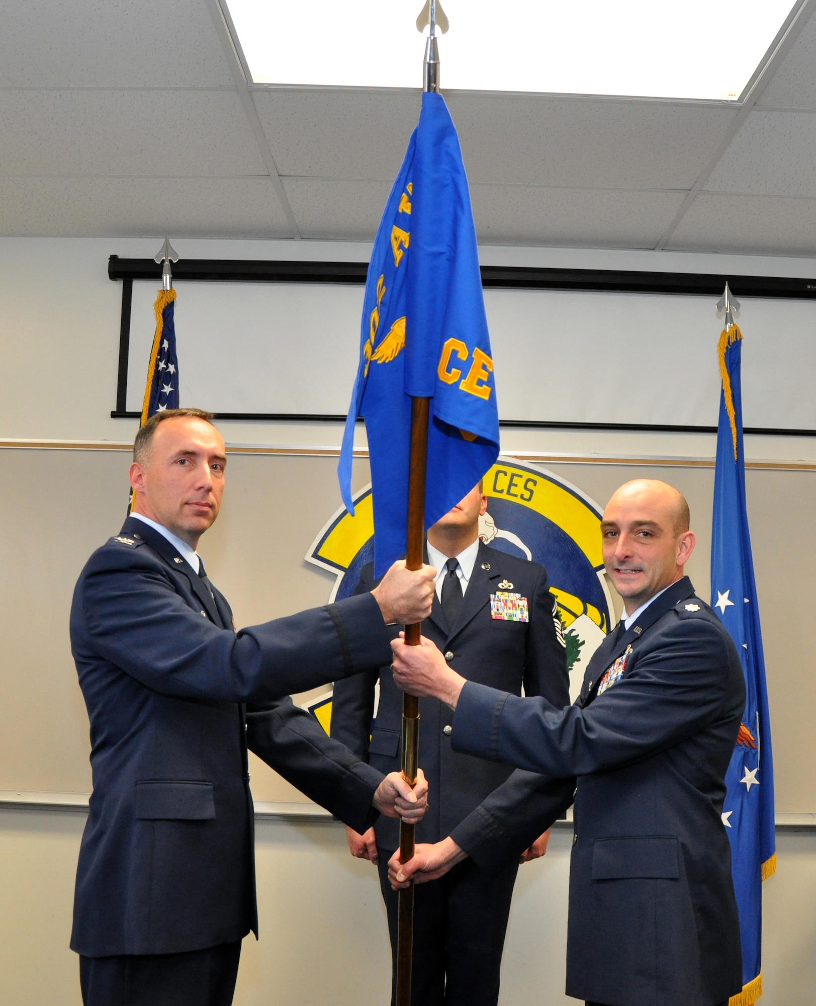 Lt. Col. John Anderson assumed command of the 302nd Civil Engineer Squadron in an assumption of command ceremony held here Dec. 3. On the left, Col. Michael Burns, 302nd Mission Support Group Commander passes the 302nd Civil Engineer Squadron's guidon to Lt. Col. John Anderson. (U.S. Air Force photo/Tech. Sgt. Peter Dean)