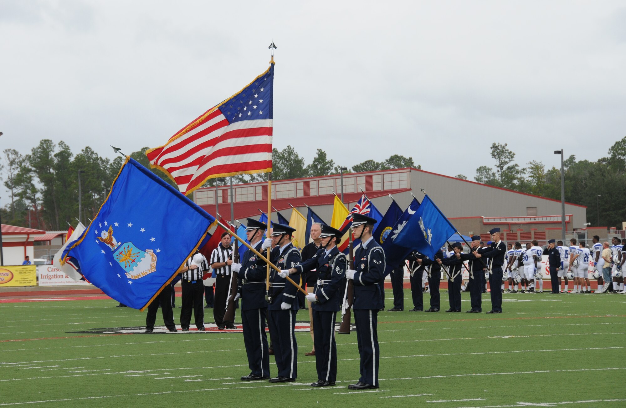 The Keesler Honor Guard and flag bearers carrying the 50 state flags participated in the Mississippi State Bowl game between Mississippi Gulf Coast Community College and Blinn College held at Biloxi High School Stadium Dec. 4, 2011.  Brig. Gen. Andrew Mueller, 81st Training Wing commander, was honored by MGCCC with the Spirit of MGCCC Award for his support of the college's athletic and academic programs.  MGCCC defeated Blinn College 46-17.  (U.S. Air Force photo by Kemberly Groue)