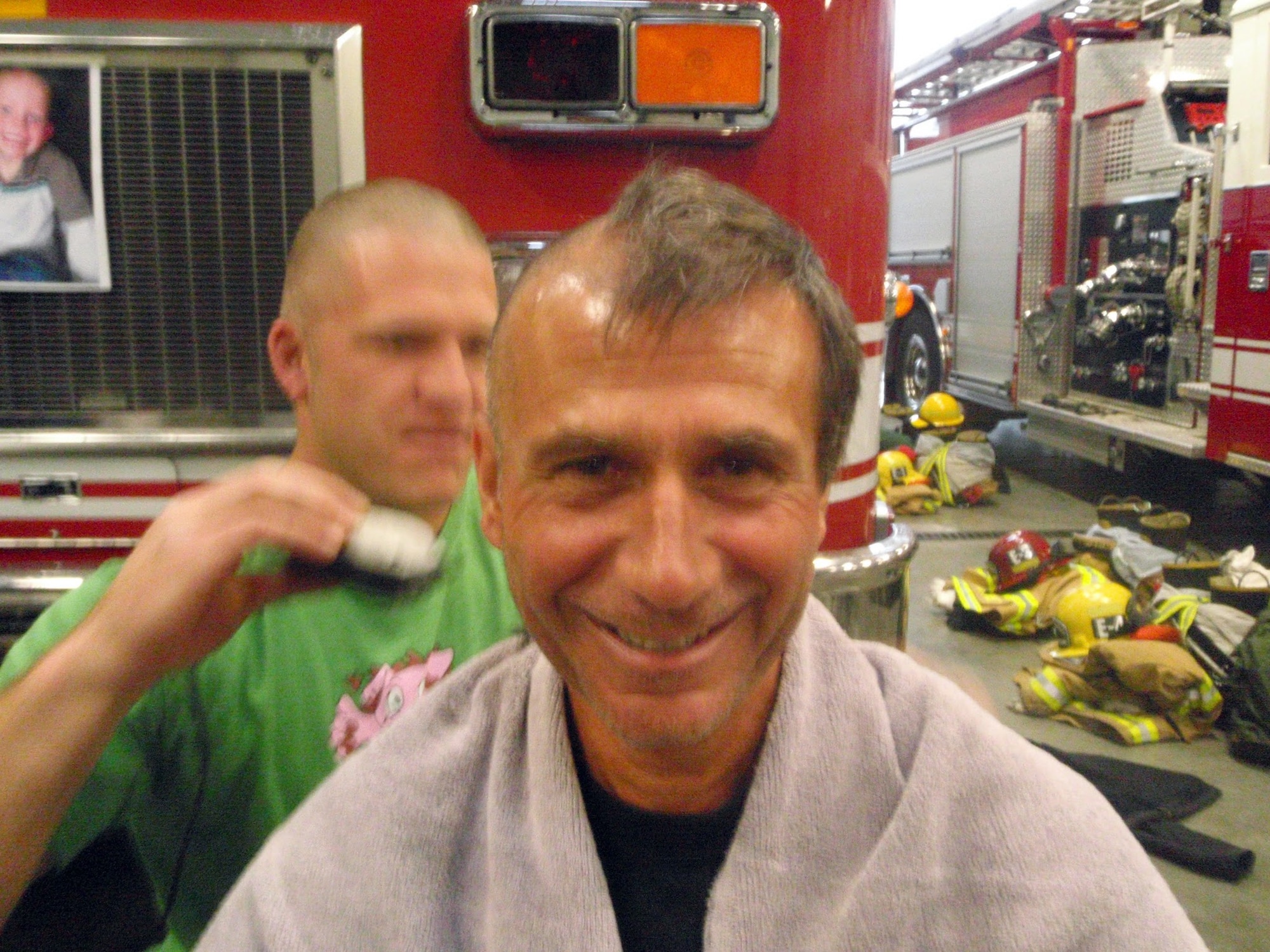 VANDENBERG AIR FORCE BASE, Calif. -- Dan Ardoin, the response division chief at Vandenberg Fire Department shaves his head heads in honor of Ryan Raffel, the 5-year-old nephew of Vandenberg Fire Department firefighter Robert Raffel, here Sunday, Nov. 20, 2011. Ryan was diagnosed with leukemia earlier this year. (Courtesy photo)