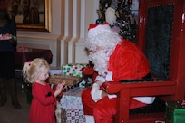 Emily Carington talks to Santa Claus during the Joint Base San Antonio-Randolph Tree Lighting Ceremony Dec. 1 in the Taj Mahal. (U.S. Air Force photo/Rich McFadden) (released)