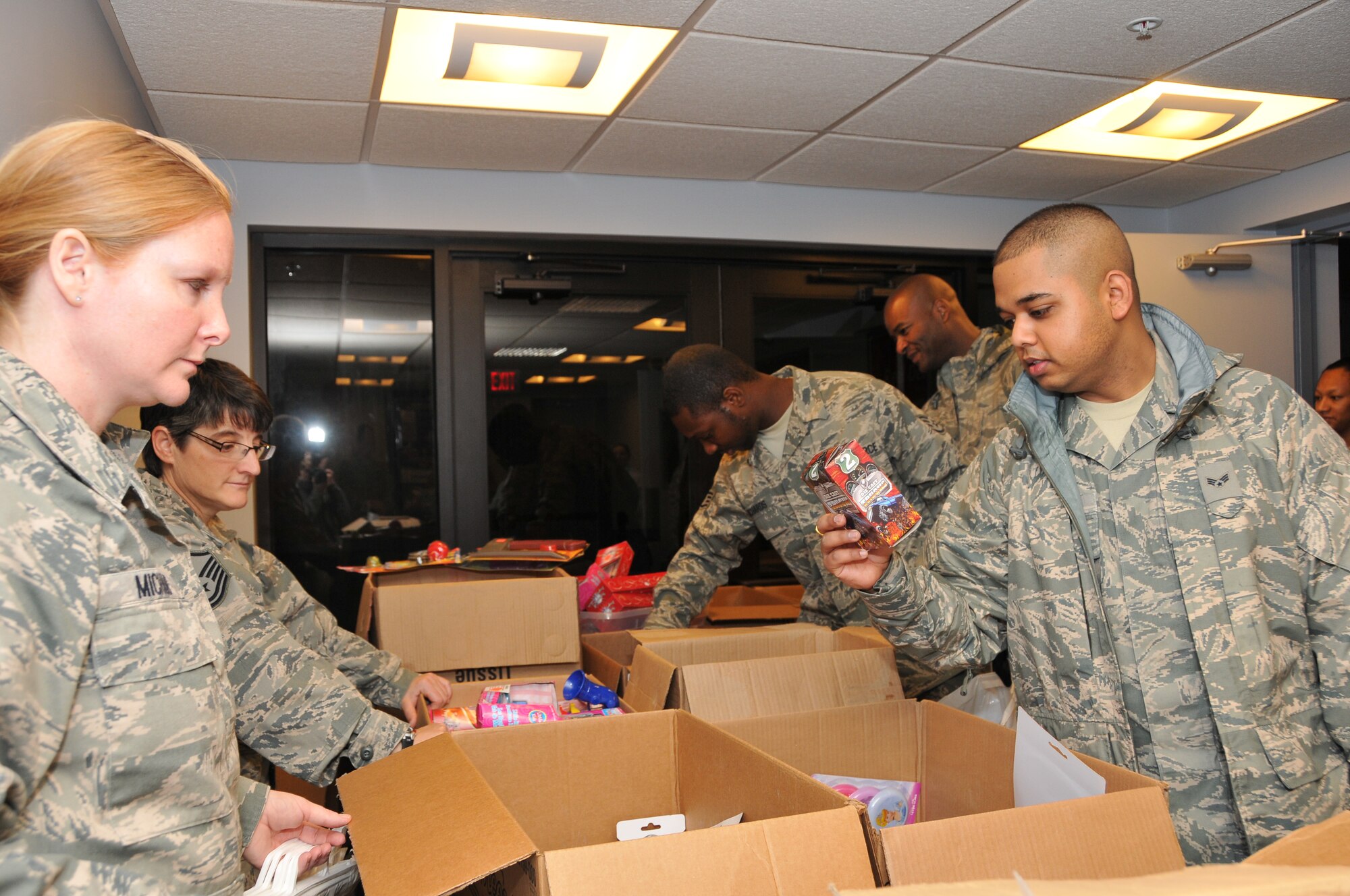Members of the 512th Airman & Family Readiness Office exhibit children’s holiday gift items donated to Liberty Wing reservists by Operation Homefront at the Dover Air Force, Del. theater Dec. 3, 2011. Operation Homefront was formed in February 2002 and developed to support the families of deployed service members immediately following 9/11. (U.S. Air Force photo by Staff Sgt. Andria J. Allmond)