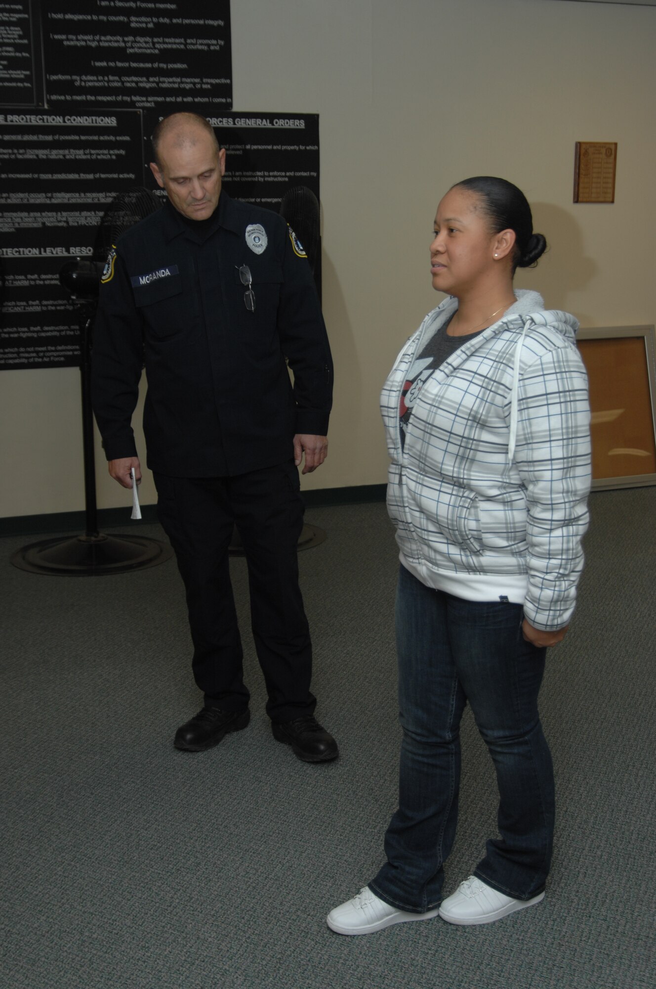 Staff Sgt. Carla Owens, 366th Fighter Wing knowledge operations manager, performs a portion of the standardized field sobriety testing Dec. 2, 2011, at Mountain Home Air Force Base, Idaho, while being observed by Michael Moranda, Department of the Air Force police officer. Owens and four others volunteered to assist 366th Security Forces Squadron personnel in the proper procedures for dealing with individuals who may be under the influence of alcohol. (U.S. Air Force photo by Senior Airman Benjamin Sutton) 