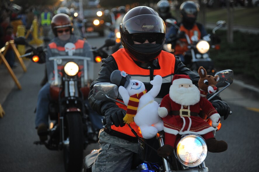 The Moody Green Knights take part in the Annual Base Tree Lighting and Holiday Parade at Moody Air Force Base, Ga., Dec. 2, 2011. About 20 Green Knight motorcyclists participated in the parade with holiday decorations on their bikes. (U.S. Air Force photo by Airman 1st Class Paul Francis/Released)
