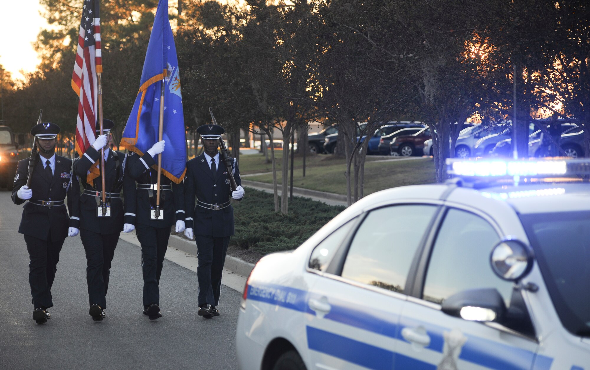 The Moody Air Force Base Honor Guard presents the colors during the Annual Base Tree Lighting and Holiday Parade Dec. 2, 2011. The parade also featured appearances by the 23rd Civil Engineer Squadron fire department, Green Knight members, the Grinch, Santa Claus and more. (U.S. Air Force photo by Airman 1st Class Paul Francis/Released)