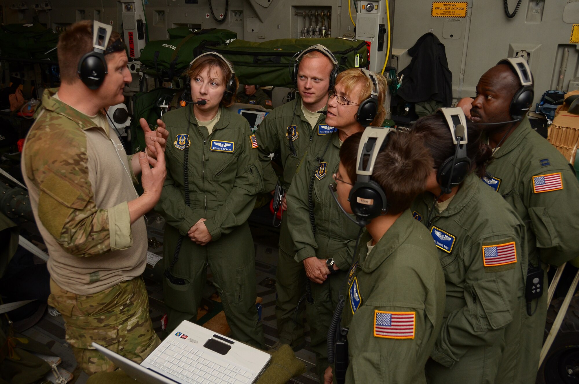 WRIGHT-PATTERSON AIR FORCE BASE, Ohio – Master Sgt. John Lane, 212th Rescue Squadron, 176th Wing, Joint Base-Elmendorf-Richardson, Alaska, gives instructions to 445th Aeromedical Evacuation Squadron reservists during a medical training scenario Oct. 4. (U.S. Air Force photo/Senior Airman Mikhail Berlin)