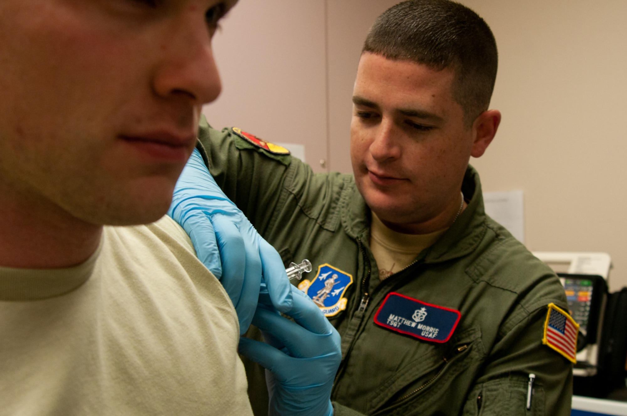 Master. Sgt. Matthew Morris, 139th Medical Group, administers an immunization to an Airman at the 139th Airlift Wing, St. Joseph, Mo., Dec. 3, 2011. Hundreds of Airmen have received the flu shot during the 2011-2012 flu season so far. (MIssouri Air National Guard photo by Senior Airman Kelsey Stuart)
