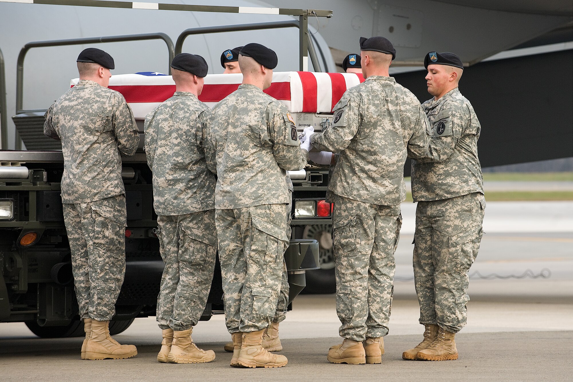 A U.S. Army carry team transfers the remains of Army Spc. Ryan M. Lumley, of Lakeland, Fla., at Dover Air Force Base, Del., Dec. 5, 2011. Lumley was assigned to Company A, 2nd Battalion, 5th Infantry Regiment, 3rd Brigade Combat Team, Ft. Bliss, Texas. (U.S. Air Force photo/Steve Kotecki)