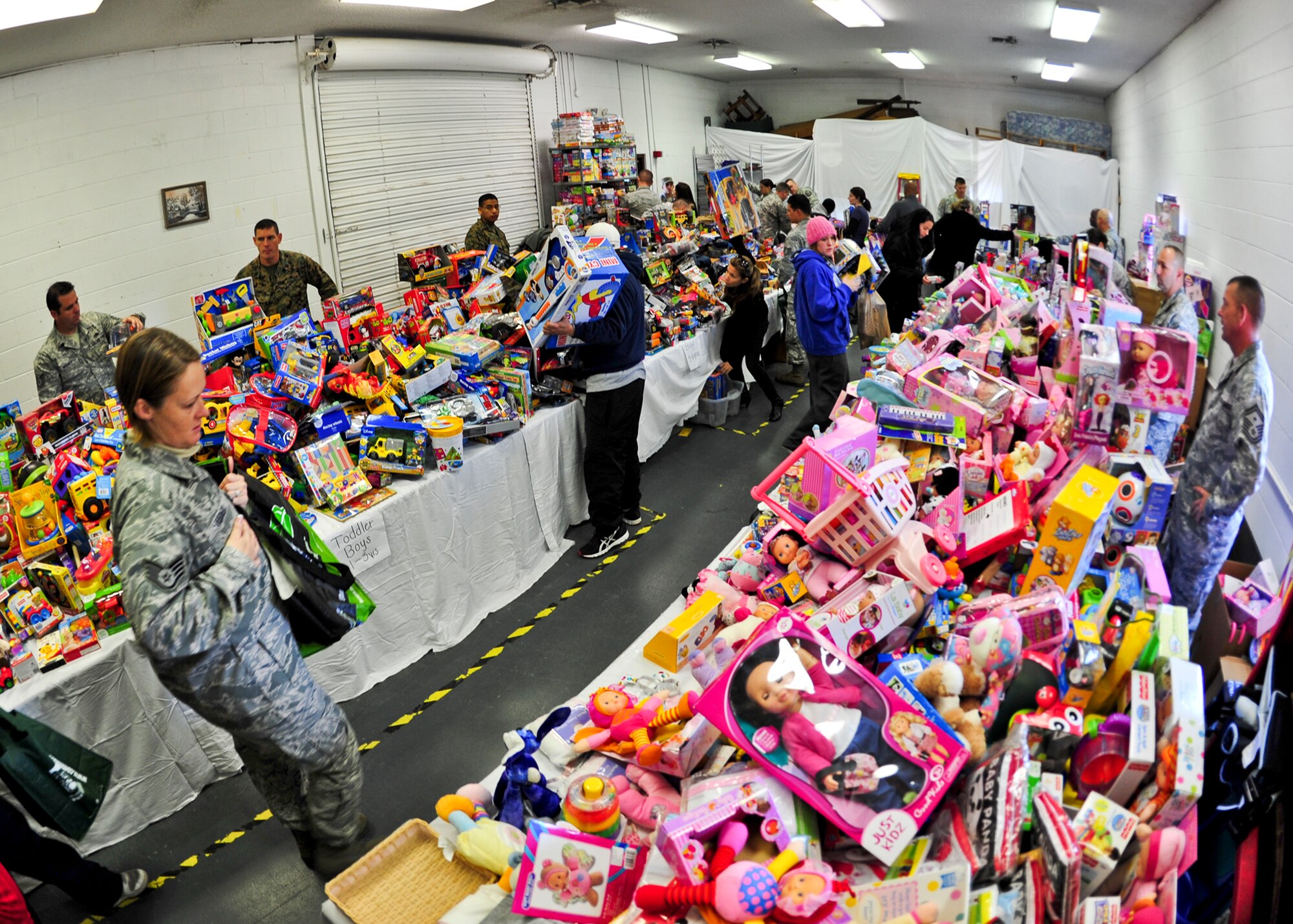 Volunteers became Santa's elves organizing more than 4,000 donated toys during the 8th annual toy distribution at the Airman's Attic Nov. 30. More than 200 families in the Eglin community were helped. (U.S. Air Force photo/Sachel Seabrook)