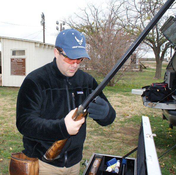 Maj. James Schmel assembles his shotgun at the Sheppard AFB Skeet Range Dec. 4, 2011. Schmel has competed on the All Air-Force Skeet Shooting team since 2007. (U.S. Air Force photo/Dan Hawkins)