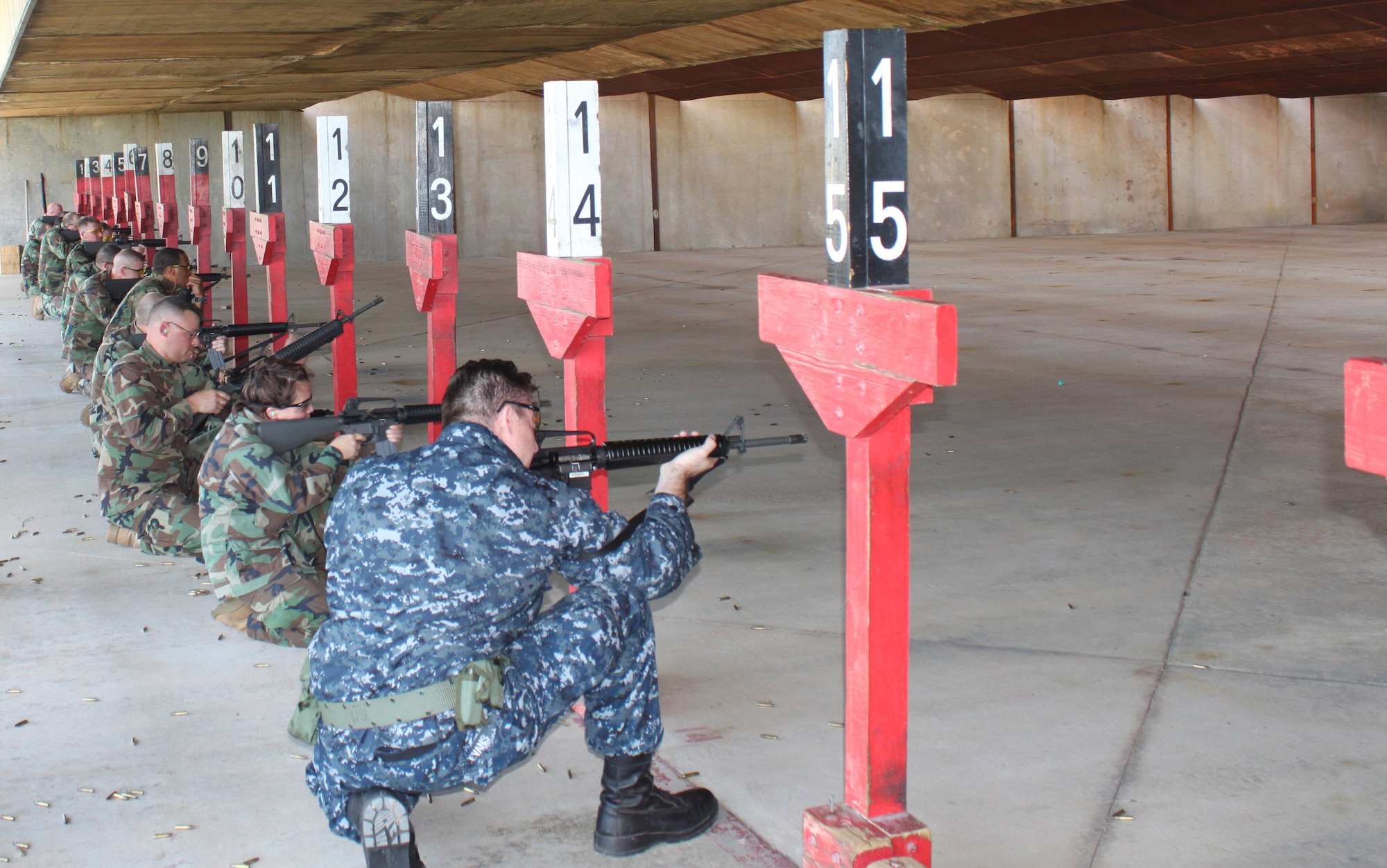 Seabees from the 28th Naval Mobile Construction Battalion fire M-16A2s at the firing range on Barksdale Air Force Base, La., July 26. Seabees provide construction and disaster recovery support for joint military forces, government and civilian agencies. (Courtesy photo)(RELEASED)