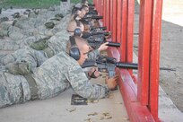 Air Force basic trainee Zachary Browning, 324th Training Squadron, Flight 044, reloads between shooting practice rounds at the firing range Nov. 22. Airmen are now required to take a new intensive Air Force Rifle Qualification Course. (U.S. Air Force photo/Alan Boedeker)