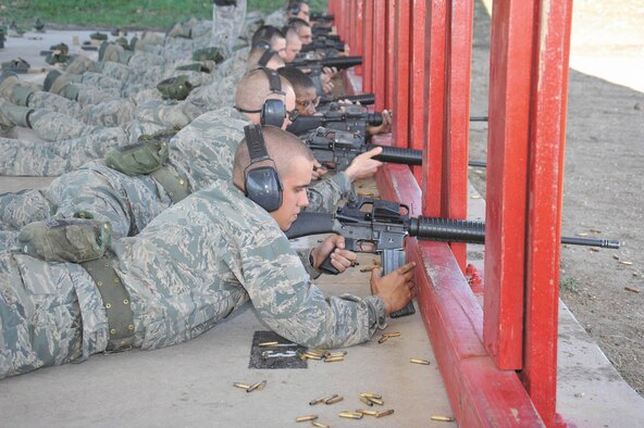 Air Force basic trainee Zachary Browning, 324th Training Squadron, Flight 044, reloads between shooting practice rounds at the firing range Nov. 22. Airmen are now required to take a new intensive Air Force Rifle Qualification Course. (U.S. Air Force photo/Alan Boedeker)