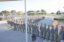 Air Force basic military trainees wait in line to be paired with host families who will take them home for Thanksgiving Nov. 24 at the BMT Reception Center. (U.S. Air Force photo/Alan Boedeker)