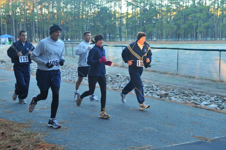 Members of the 4th Fighter Wing Command section participate in the Holiday-Run-a-Thon at Seymour Johnson Air Force Base, N.C., Dec. 2, 2011.  The event was held at the former prison track here and proceeds will benefit several charities and quality of life projects for Airmen. This event is one of many that will celebrate the holiday season, including the base Christmas tree lighting and a breakfast with Santa for children. (U.S. Air Force photo by Senior Airman Marissa Tucker)