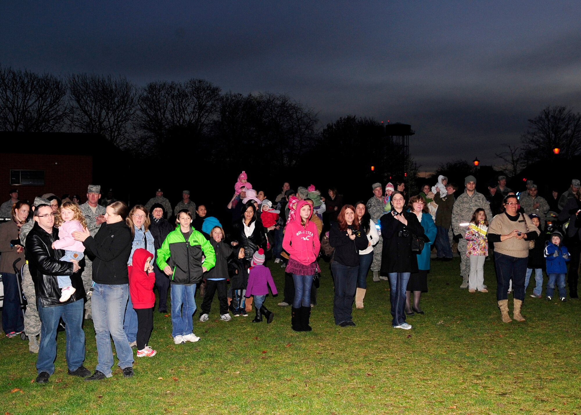 RAF MILDENHALL, England – Members of Team Mildenhall gather around to see the annual Christmas Tree Lighting Ceremony here Dec. 2, 2011. The event, presided over by Col. Christopher Kulas, 100th Air Refueling Wing commander, celebrated the beginning of the holiday season for RAF Mildenhall. (U.S. Air Force photo/Senior Airman Ethan Morgan) 