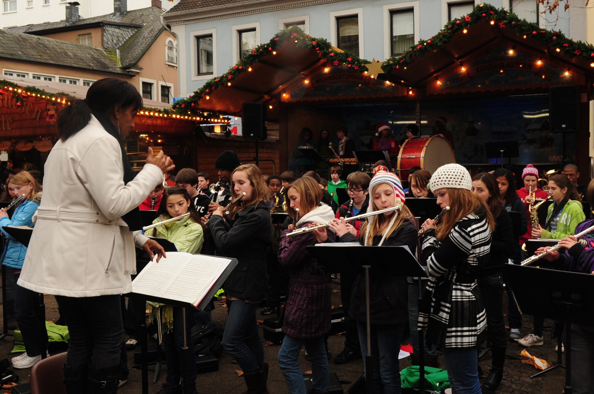 The Ramstein Middle School intermediate and advance band performs for the German and American community during the Christmas market in Kaiserslautern, Germany, Dec. 1, 2011. The market will be set up until Dec. 23 near Stiftskirche str. and on Schillerplatz str. (U.S. Air Force photo by Senior Airman Aaron-Forrest Wainwright) 
