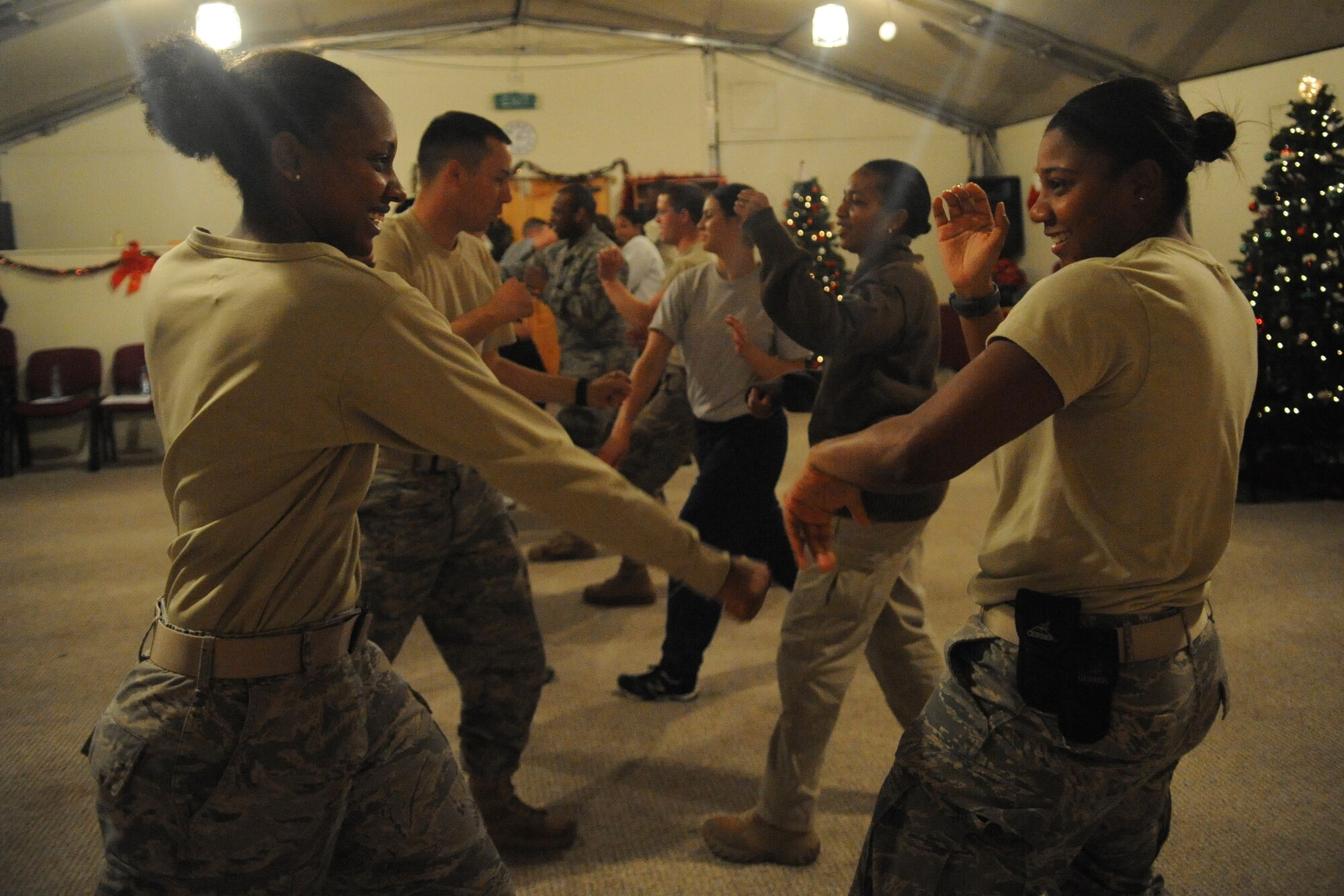 A group of students practice blocking techniques during a self-defense class here Dec. 3, 2011. The students learned basic blocking and striking techniques during the three-hour class. A second class, which takes place Dec. 10, will equip students with more advanced skills. (U.S. Air Force photo/Tech. Sgt. Tammie Moore)