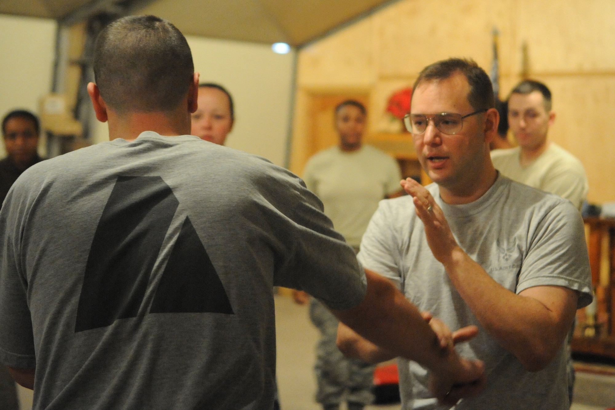 Staff Sgt. Scott Southwick teaches students a blocking technique during a self-defense class here Dec. 3, 2011. Southwick is an Uchudo 6th degree black belt, master instructor. He is a 376th Air Expeditionary Wing chaplain assistant deployed from the Idaho Air National Guard’s 124th Fighter Wing. (U.S. Air Force photo/Tech. Sgt. Tammie Moore)