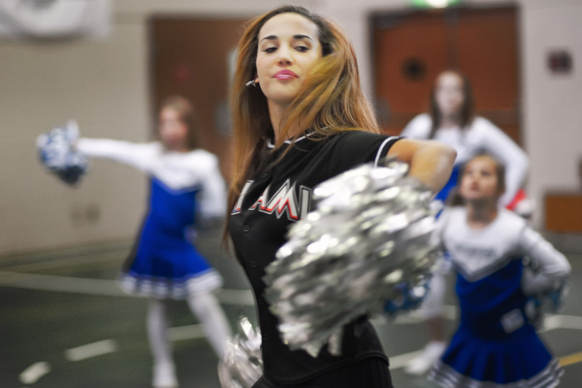 YOKOTA AIR BASE, Japan -- Ashley, of the Marlins Mermaids, teaches cheers to participants during a dance clinic held at the Yokota Youth Center, Dec. 3, 2011. The Mermaids, along with Billy the Marlin and Marlins players, held activities such as a baseball clinic, a dance clinic and meet and greets, sponsored by Armed Forces Entertainment.  (U.S. Air Force photo/Osakabe Yasuo)