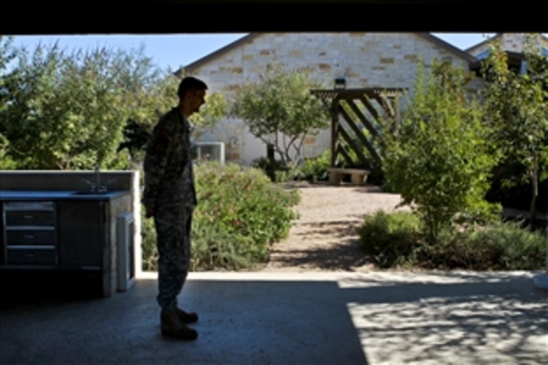 Army Staff Sgt. Kevin Collins stands under a pavillion on the grounds of the Warrior and Family Support Center in San Antonio, Nov. 10, 2011. He is one of many service members who use the center for relaxation and interaction with other warriors as they seek treatment at Brooke Army Medical Center on Fort Sam Houston.