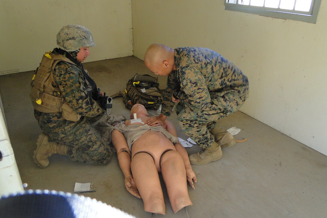 HM1 (FMF) McHale critiques a student durring the Final exercise at Field Medical Training Battalion West.