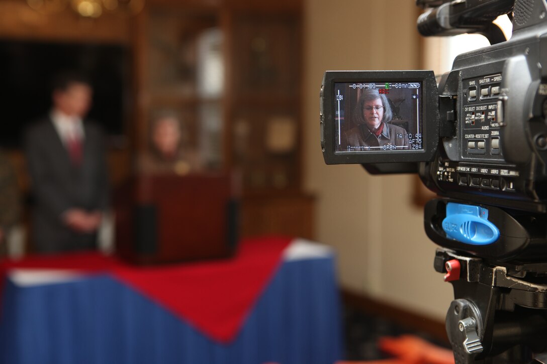 Roy Cooper, North Carolina attorney general, and Holly Petraeus, the assistant director for the Office of Service Member Affairs, Consumer Financial Protection Bureau, speak to the media during a press conference at the Paradise Point Officers' Club aboard Marine Corps Base Camp Lejeune, Dec. 6, to hear from Marines and sailors about scams they've encountered. Since the Dodds-Frank financial bill passed this year, the CFPB Office of Service Member Affairs was created to protect service members and their families from fraudulent business activity