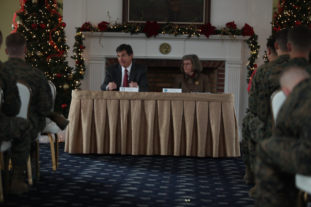 Roy Cooper, North Carolina attorney general, and Holly Petraeus, the assistant director for the Office of Service Member Affairs, Consumer Financial Protection Bureau, speak to service members at the Paradise Point Officers' Club aboard Marine Corps Base Camp Lejeune, Dec. 6, to hear from Marines and sailors about scams they've encountered. Since the Dodds-Frank financial bill passed this year, the CFPB Office of Service Members Affairs was created to protect service members and their families from fraudulent business activity.::r::::n::::r::::n::::r::::n::