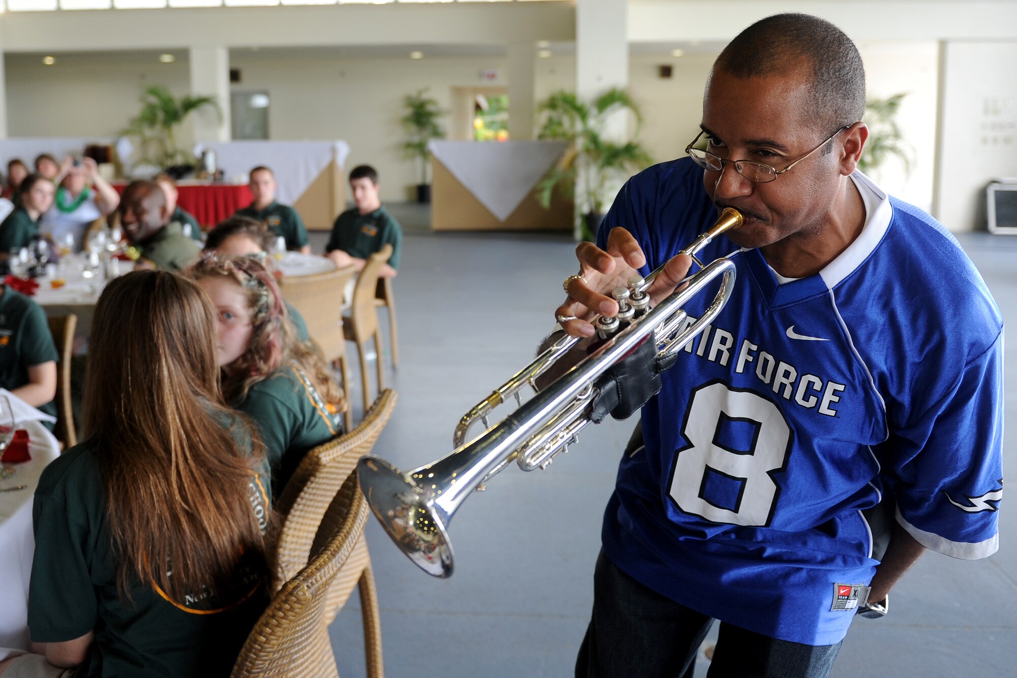 Tech. Sgt. Michael Hornbuckle,  Hana Hou and the Papana Jazz Ensemble performer for U.S. Air Force Band of the Pacific, gets wild on the trumpet during a performance for the students of the Central High School Marching Band, Manchester, New Hampshire, Dec. 6, 2011, at the Hickam Officer's Club. The high band performed at Atterbury Circle, Joint Base Pearl Harbor-Hickam, Hawaii, on Dec. 6, 2011, for Airmen earlier in the day. (U.S. Air Force photo/Staff Sgt. Mike Meares) 