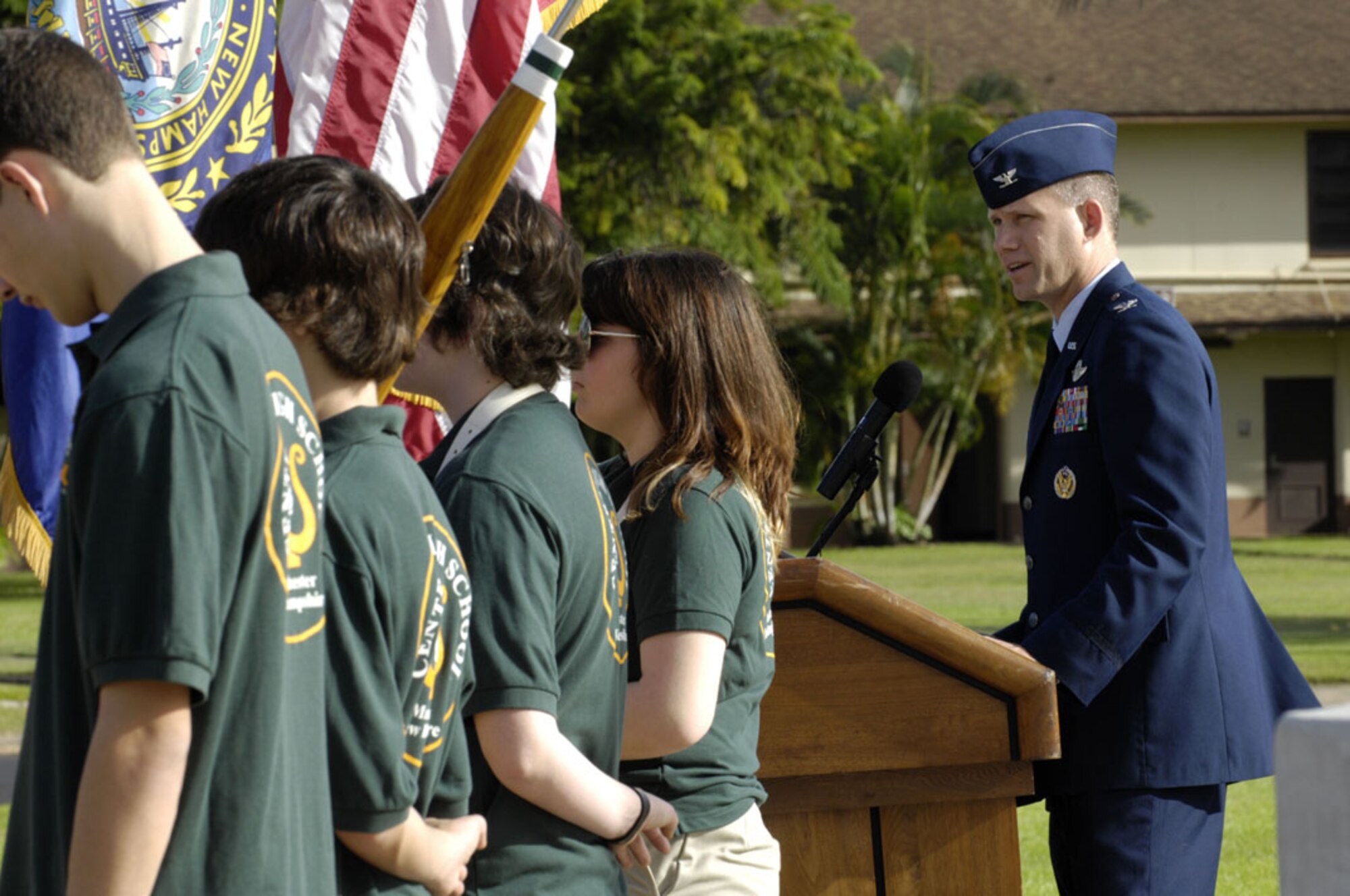 Col. Dan Baldessari, 15th Operations Group commnader, Joint Base Pearl Harbor-Hickam, Hawaii, speaks during a ceremony at Atterbury Circle honoring fallen Central High School, Manchester, New Hampshire alumni who were killed in action on Dec. 7, 1941, during the Pearl Harbor and Hickam Field attacks. The band performed for the crowd gather at the flag pole. (U.S. Navy photo/David D. Underwood, Jr.)
