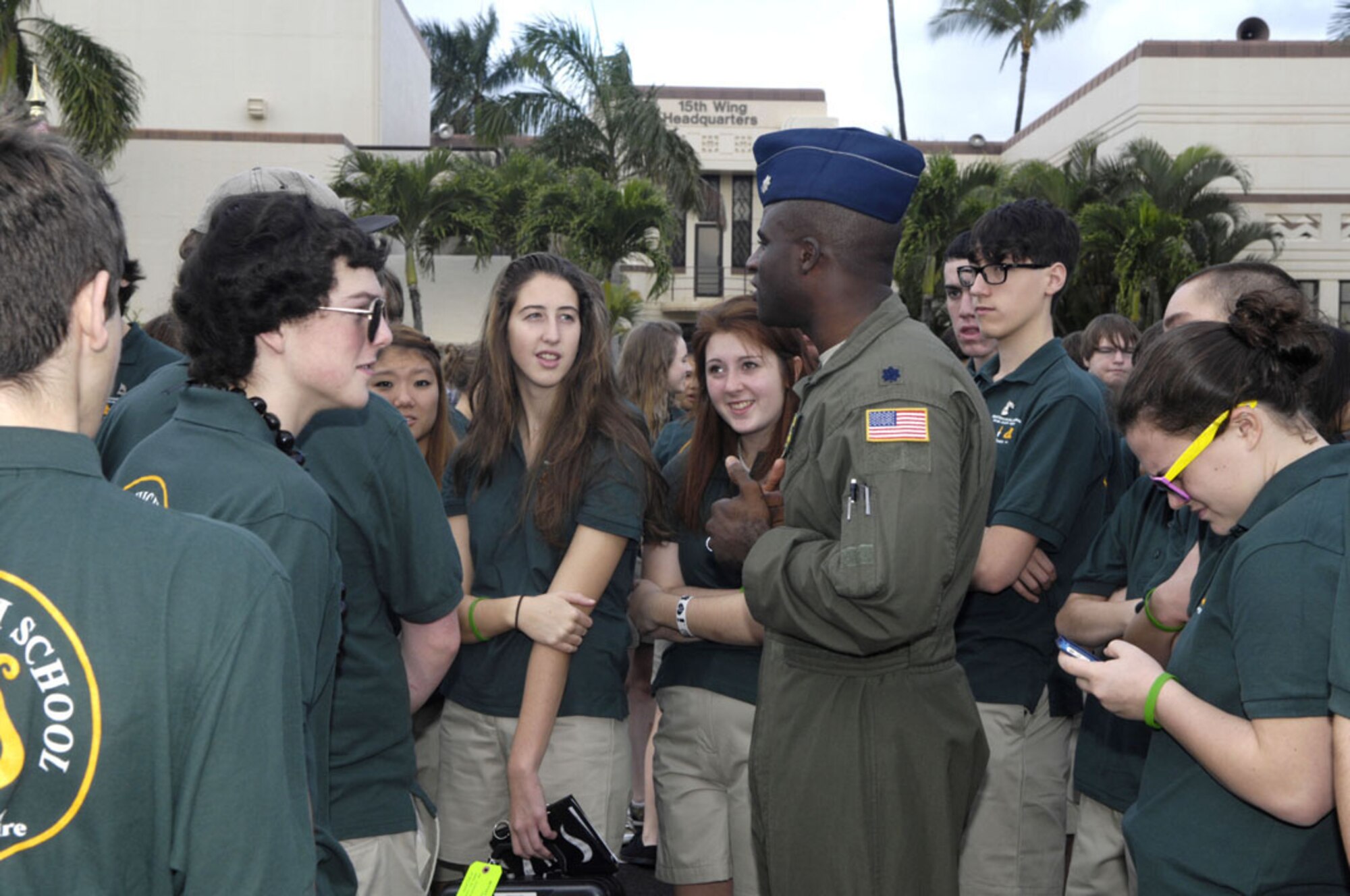Lt. Col. Brian Hill, 96th Air Refueling Squadron commander, Joint
Base Pearl Harbor-Hickam, Hawaii, talks with students from Central High
School Marching Band, Manchester, New Hampshire, during thier visit Dec. 6. The high school band came to Hawaii to pay tribute to three fallen CHS alumni during a ceremony at Atterbury Circle. The alumni are Joseph J. Jedrysik, who was killed in action on Hickam Field, Dec 7, 1941; David L. Crossett  was killed in action while aboard the USS Utah, Dec. 7, 1941; and Joseph Rozmus is still entombed in the USS
Arizona.  (U.S. Navy photo/David D. Underwood, Jr.)
