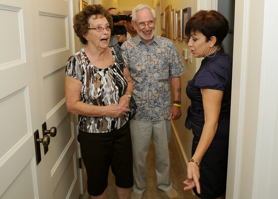 Concetta Xadzipulos, spouse of Master Sgt. Dimitros Xadzipulos, a communications planner for 13th Air Force, opens up her home to Hickam Field survivors Larry Bush and Deloris Anderson, at Joint Base Pearl Harbor-Hickam, Dec. 5, 2011.   As children of an Airman stationed at Hickam Field, the siblings who were only 5- and 8-, were home Dec. 7. 1941 and survived the sudden attacks by the Japanese. The siblings visited the base where 70 years ago they survived, ahead of the 70th Anniversary commemoration of the attacks on U.S. military forces stationed at Oahu.  (U.S. Air Force photo/Tech. Sgt. Jerome S. Tayborn/Released)