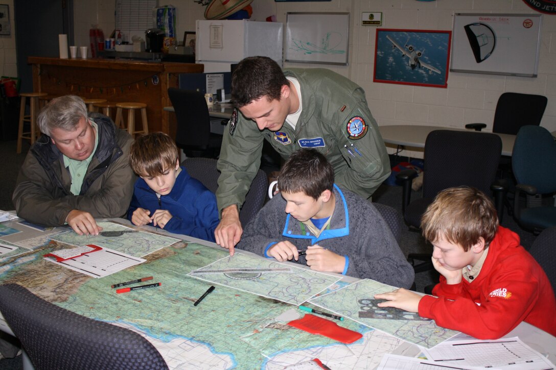 A student pilot teaches basic navigation skills to Boy Scouts from the surrounding community Dec. 3 at Sheppard Air Force Base.