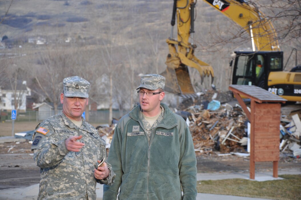 CENTERVILLE, Utah - Members of the Utah Army and Air National Guard assist with clean-up efforts from a wind storm in Davis County, Utah on Dec. 4, 2011.  Utah Governor Gary Herbert activated approximately 200 members of the Guard to assist local authorities with emergency response clean-up, and to prepare for an upcoming storm.  More than 25 heavy equipment vehicles were also dispatched to assist with the efforts. U.S. Army photo by 1LT Ryan Sutherland (RELEASED).