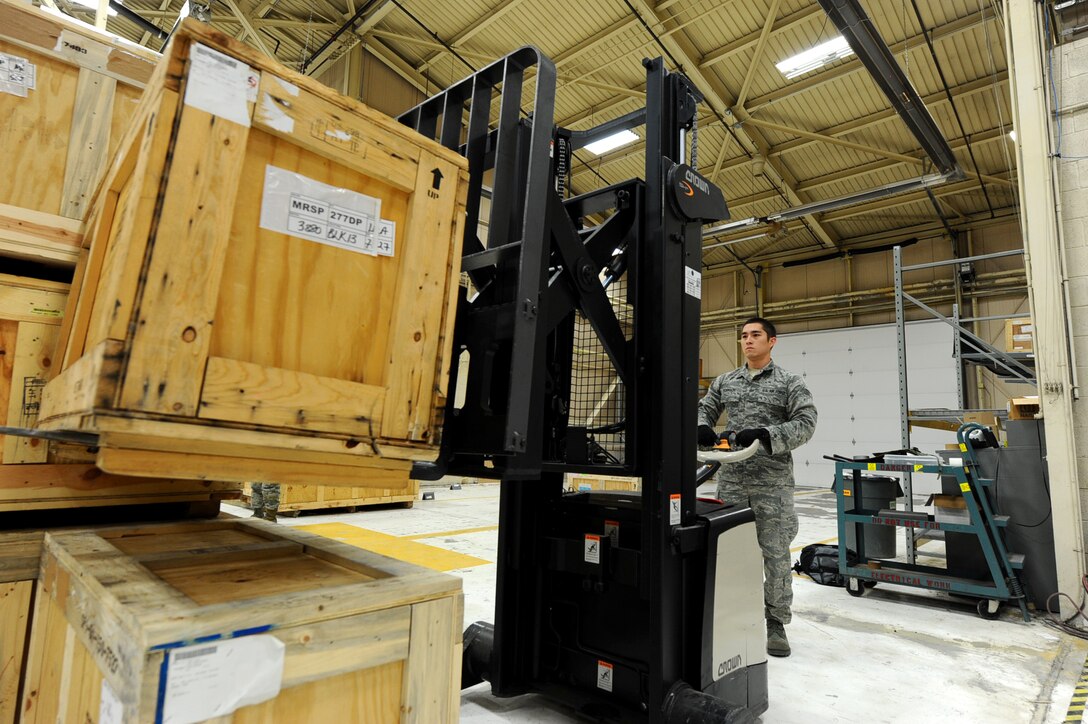 Senior Airman Chris Robinson, 28th Logistics Readiness Squadron aircraft parts technician, stacks crates of aircraft parts on a pallet at Dock 63 on Ellsworth Air Force Base, S.D., Nov. 3, 2011. Airmen across the Air Force will be tasked with looking for opportunities to conduct their jobs more efficiently and effectively now and in the future. (U.S. Air Force photo by Airman 1st Class Zachary Hada/Released)