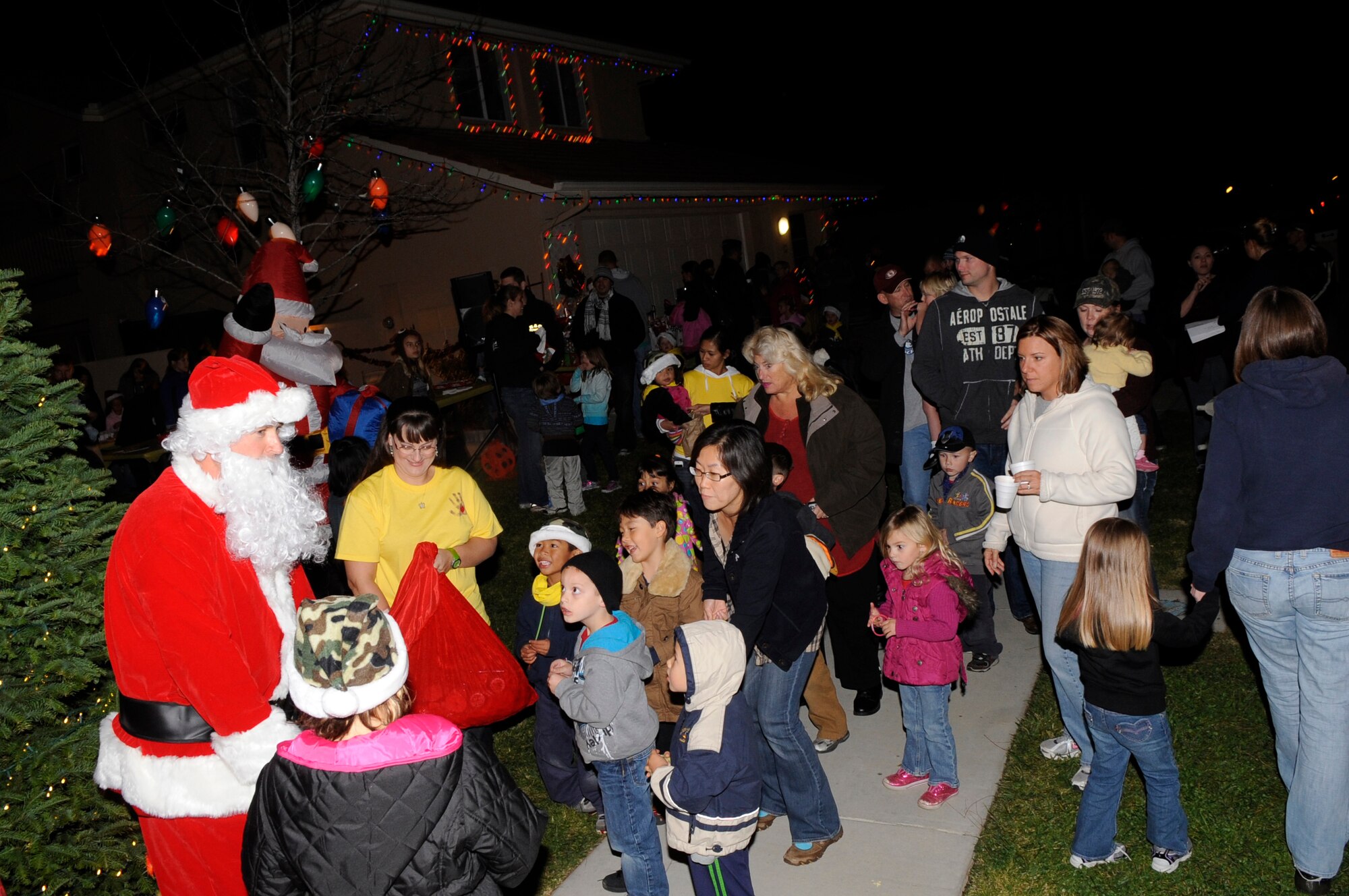 VANDENBERG AIR FORCE BASE, Calif. – A very special visitor from the North Pole, Santa Claus, came to see the children of the Vandenberg Air Force Base community during a Christmas tree lighting ceremony here Monday Dec. 5, 2011. The tree was handpicked by the children of the VAFB Family Child Care program and donated to the VAFB community in honor of deployed service members and their families. (U.S. Air Force photo/ Tech Sgt. Scottie T. McCord)