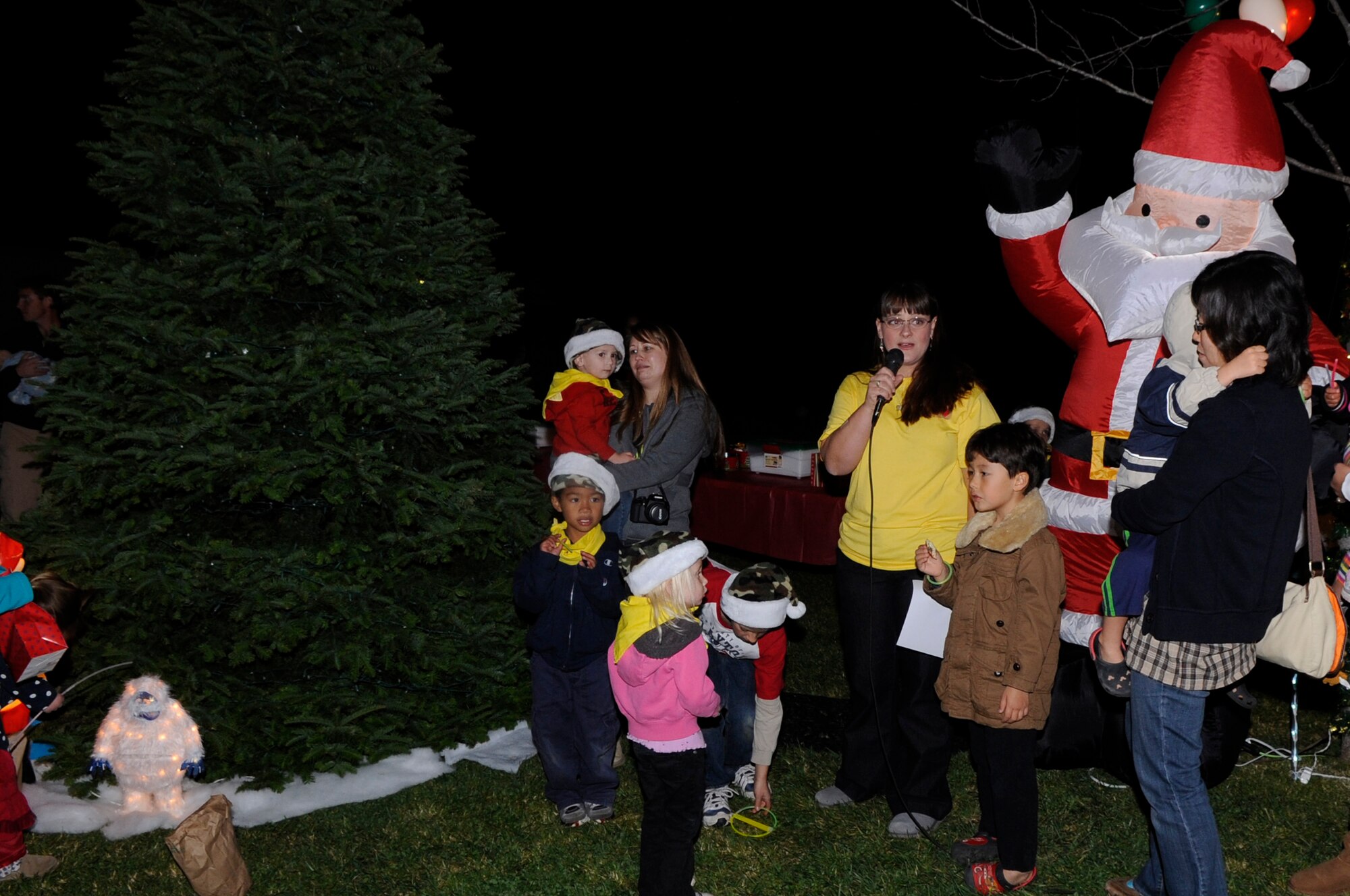 VANDENBERG AIR FORCE BASE, Calif. – Elizabeth Bryant, a Vandenberg Air Force Base Family Child Care provider, thanks the VAFB leadership and community for supporting  the Christmas tree lighting ceremony held Monday, Dec. 5, 2011.  Anyone in the VAFB community is welcome to come to 345 Oceanview Ave. to decorate an ornament or hang a yellow ribbon for deployed heroes Dec. 5-25. (U.S. Air Force photo/ Tech Sgt. Scottie T. McCord)