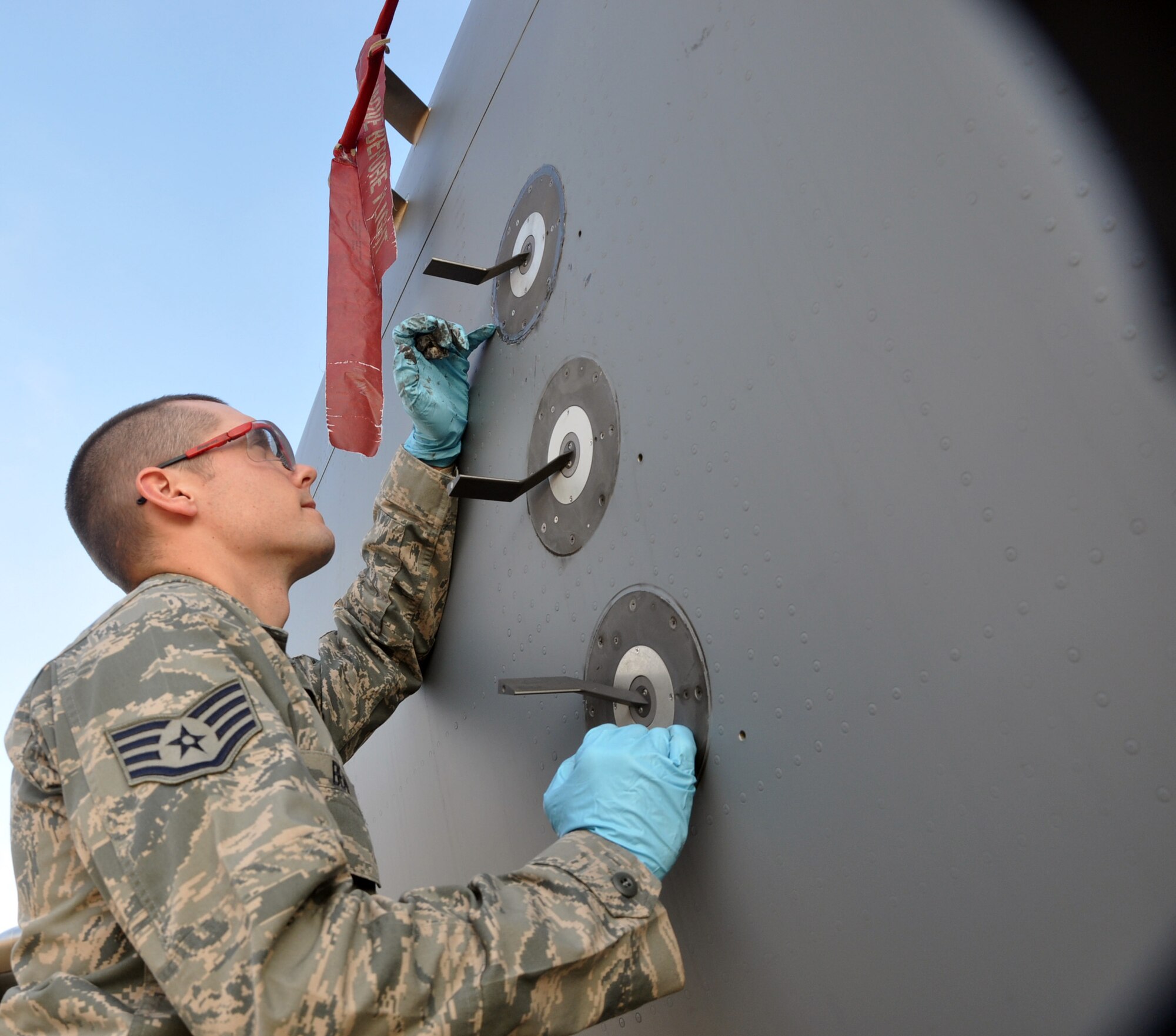 Staff Sgt. Matthew Bean, 446th Aircraft Maintenance Squadron crew chief  here, replaces an angle of attack seal on a C-17 Globemaster III at McChord Field Dec. 5.  The angle of attack is an indicator on the fuselage which provides a horizontal reference line during flight.  Bean has been a Reservist for six years and is a logger in Forest Grove, Ore., in his civilian job.