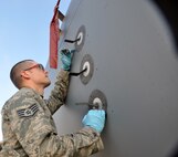 Staff Sgt. Matthew Bean, 446th Aircraft Maintenance Squadron crew chief  here, replaces an angle of attack seal on a C-17 Globemaster III at McChord Field Dec. 5.  The angle of attack is an indicator on the fuselage which provides a horizontal reference line during flight.  Bean has been a Reservist for six years and is a logger in Forest Grove, Ore., in his civilian job.
