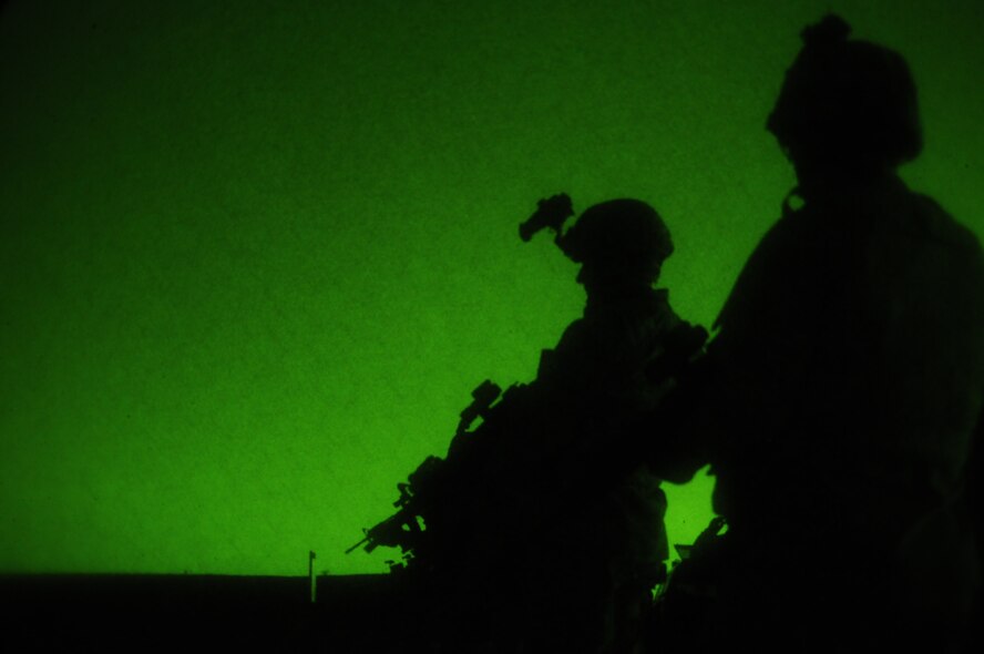 Members of the 161st Security Forces Squadron participate in weapons qualification Dec. 5, 2011, at the National Guard training range in Florence, Ariz. Beginning Dec. 1, 2011, all Airmen are required to qualify in a new rifle course. Security forces is one of the career fields in which members must undergo night firing qualification. (U.S. Air Force photo/Tech. Sgt. Susan Gladstein)