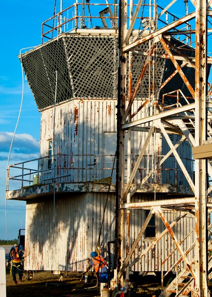 Workers begin to move Duke Field’s old air traffic control tower toward a flat bed truck after it was taken down Dec. 3.  The tower, managed by the 46th Test Wing, was continuously used in guiding in aircraft at Duke Field since the 1950s.  It was replaced with a new tower this year.  (U.S. Air Force photo/Samuel King Jr.)
