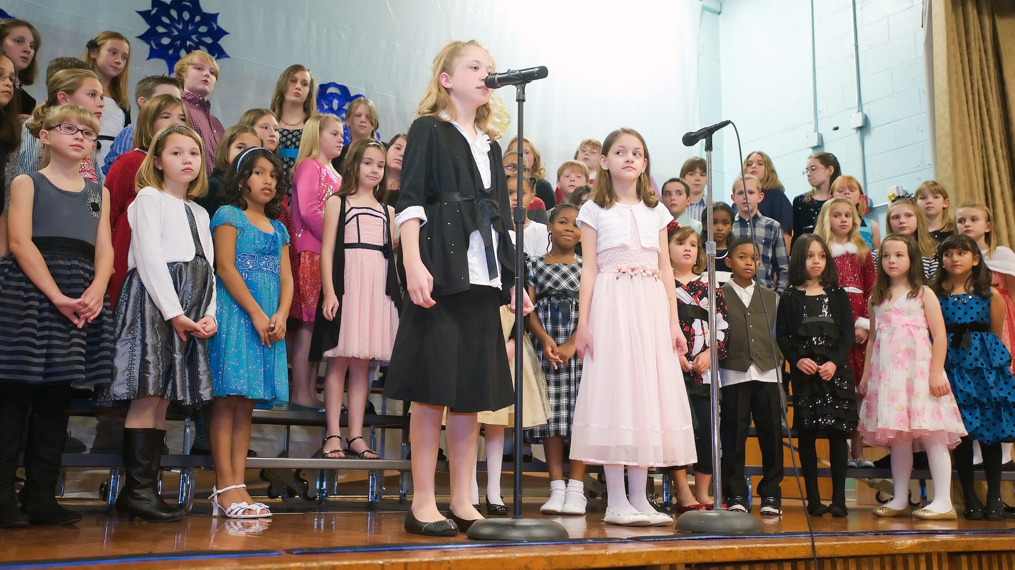 Welsh Elementary School students sing for their parents during a concert Dec. 2, 2011, at Dover Air Force Base, Del. The set included several holiday themed pieces. (U.S. Air Force photo by Airman 1st Class Samuel Taylor)