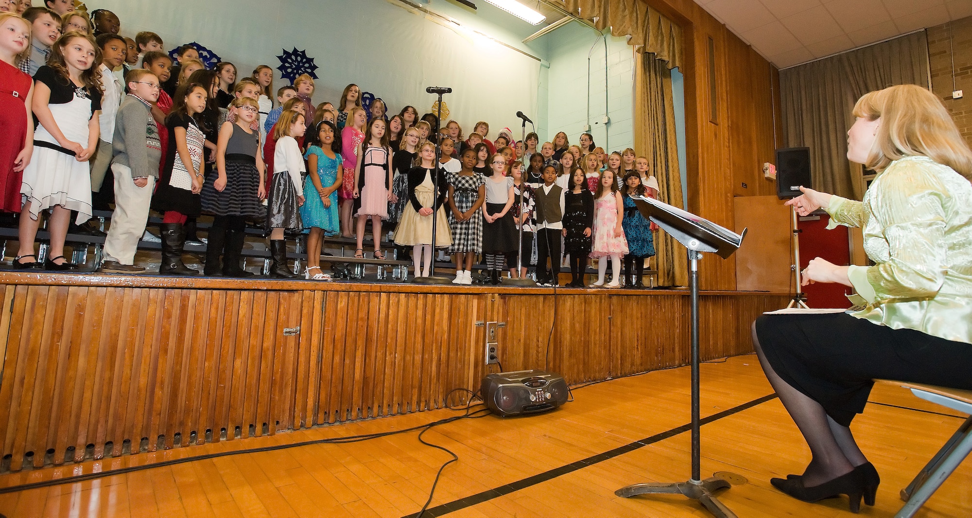 Welsh Elementary School students sing for their parents during a concert Dec. 2, 2011, at Dover Air Force Base, Del. The set included several holiday themed pieces. (U.S. Air Force photo by Airman 1st Class Samuel Taylor)