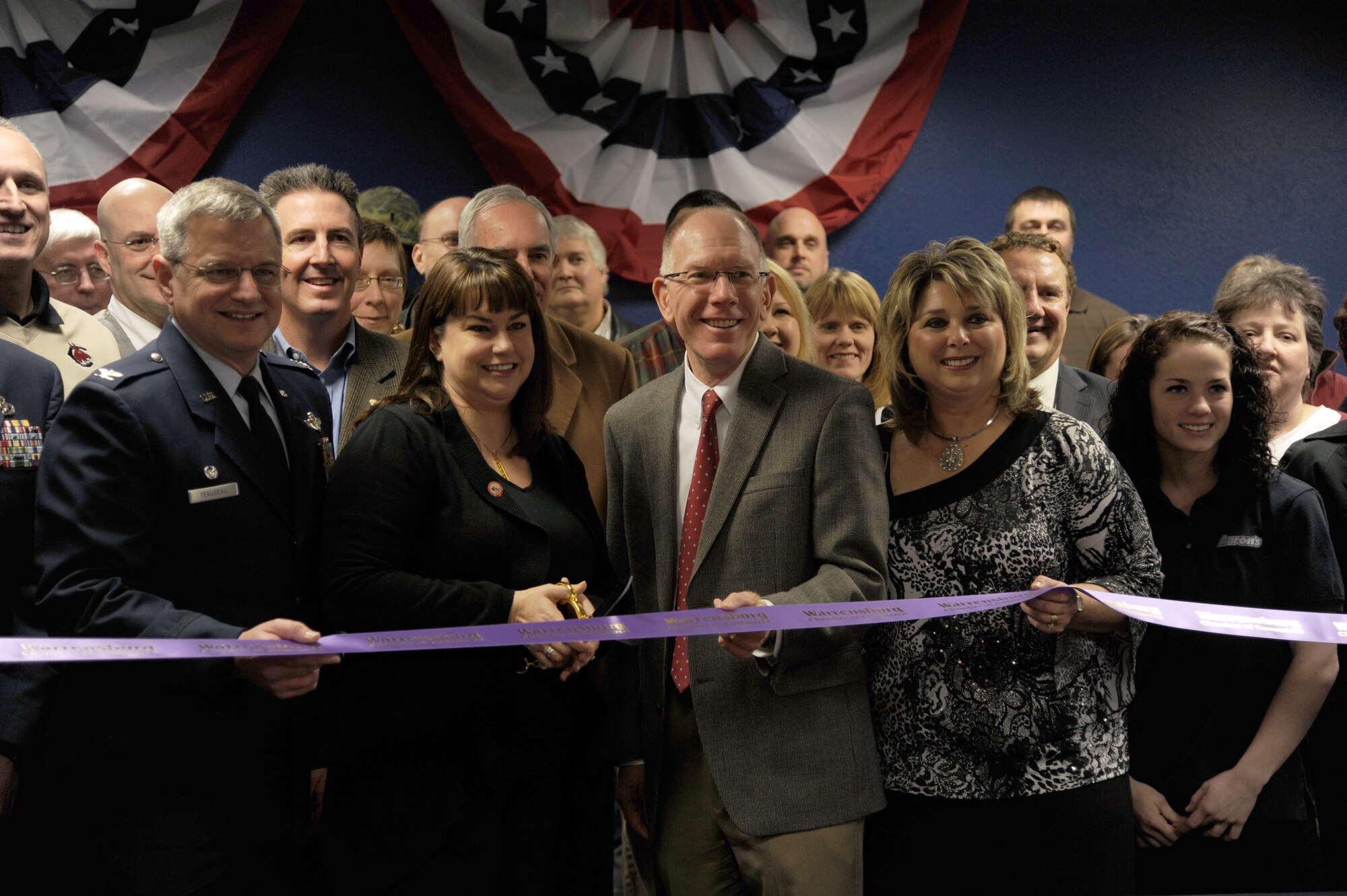 Christie Eckfeld (second from left), wife of 442nd Fighter Wing vice commander, Col. Gregory Eckfeld, along with Dr. Charles Ambrose (center), University of Central Missouri president, participate in the ribbon-cutting ceremony at the UCM Veterans Services Center, Dec. 6, 2011. The center is designed to help servicemembers and dependents more easily pursue a college degree. Also pictured: Col. Alan Teauseau (left), 442nd Mission Support Group commander, and Delilah Nichols, UCM Veterans Services. The 442nd Fighter Wing is an A-10 Thunderbolt II Air Force Reserve unit at Whiteman Air Force Base, Mo. (U.S. Air Force photo/Staff Sgt. Lauren Padden)