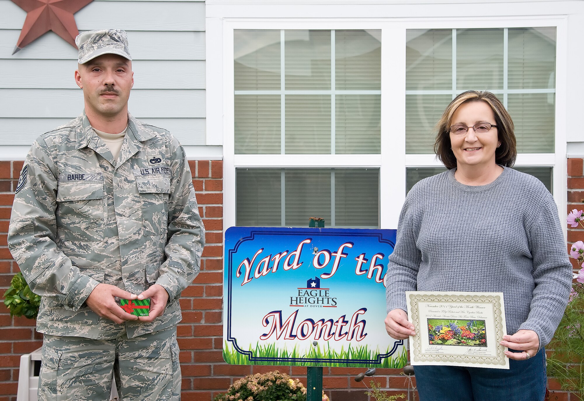 Tech. Sgt. Robert Barbe and his wife, Cynthia, were recognized as the Blue Heron Breeze Yard of the Month winners for November at Dover Air Force Base, Del. (U.S. Air Force photo by Adrian Rowan)